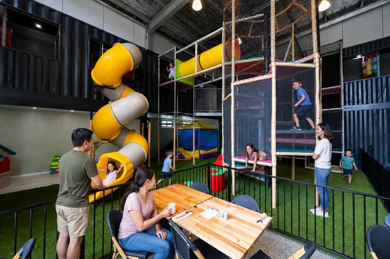 Kids on the double-storey Playpen slide