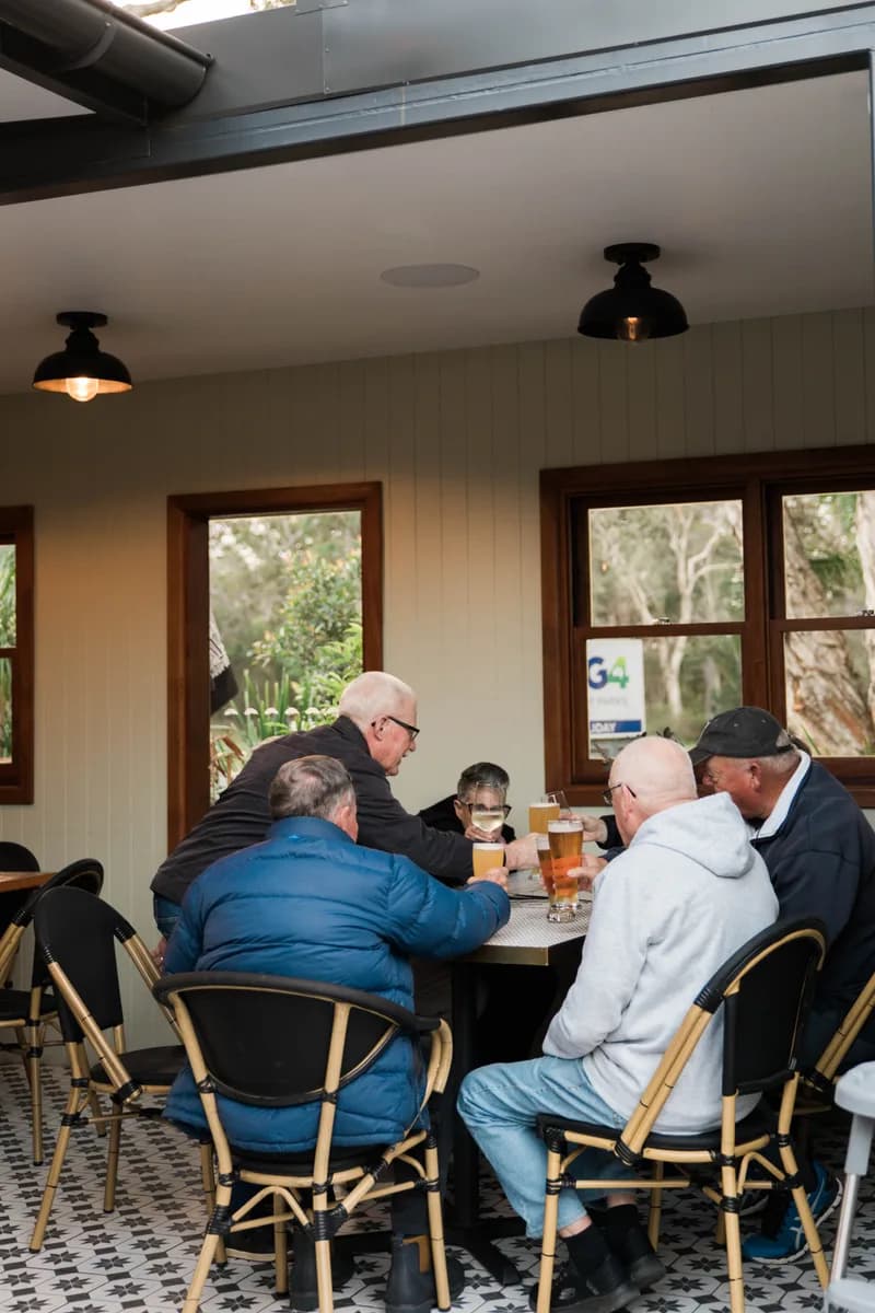 Locals gathered around a table at The 383